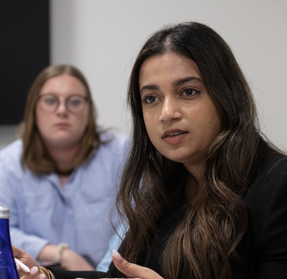 Student speaks during round-table conversation