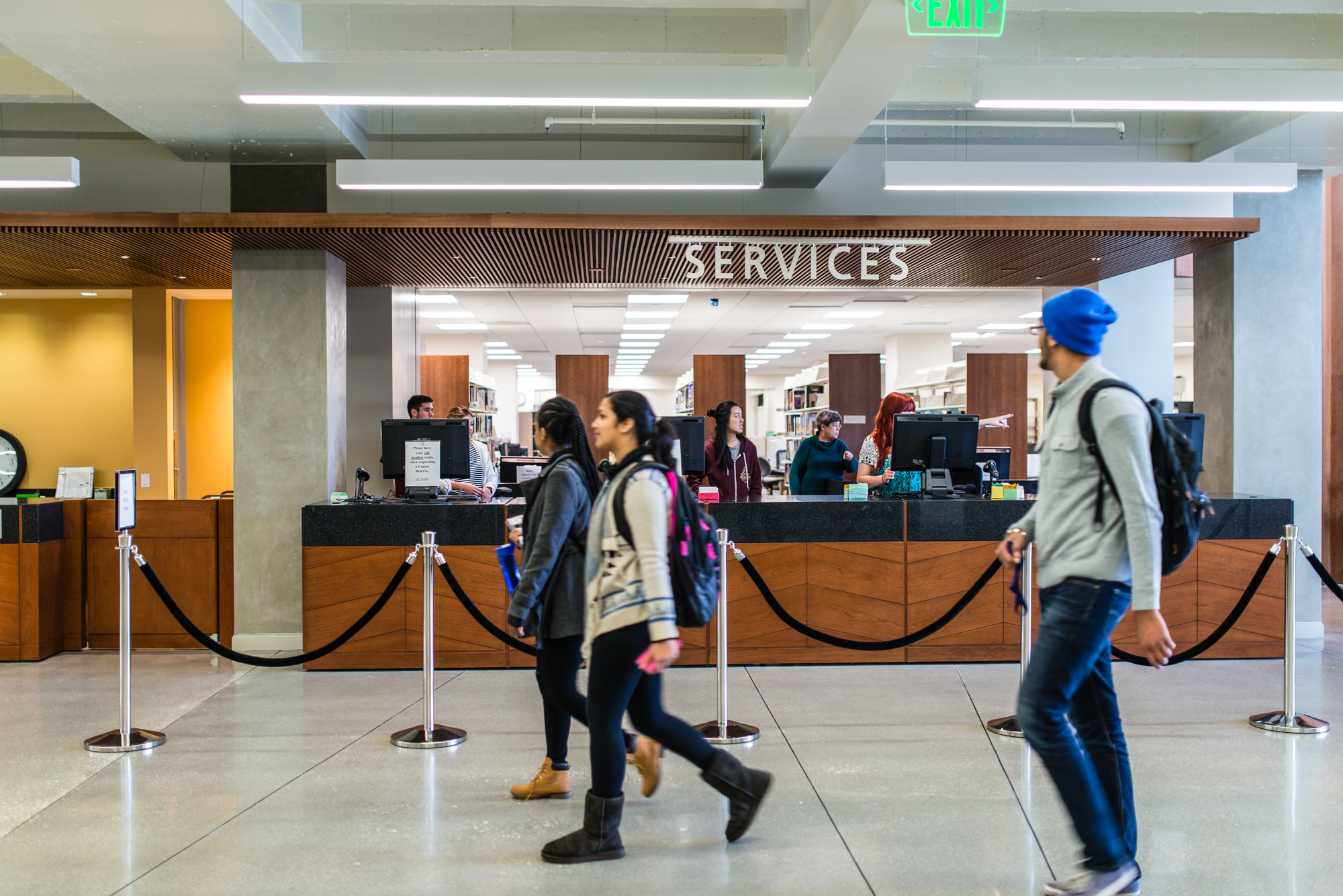 people walking through a lobby